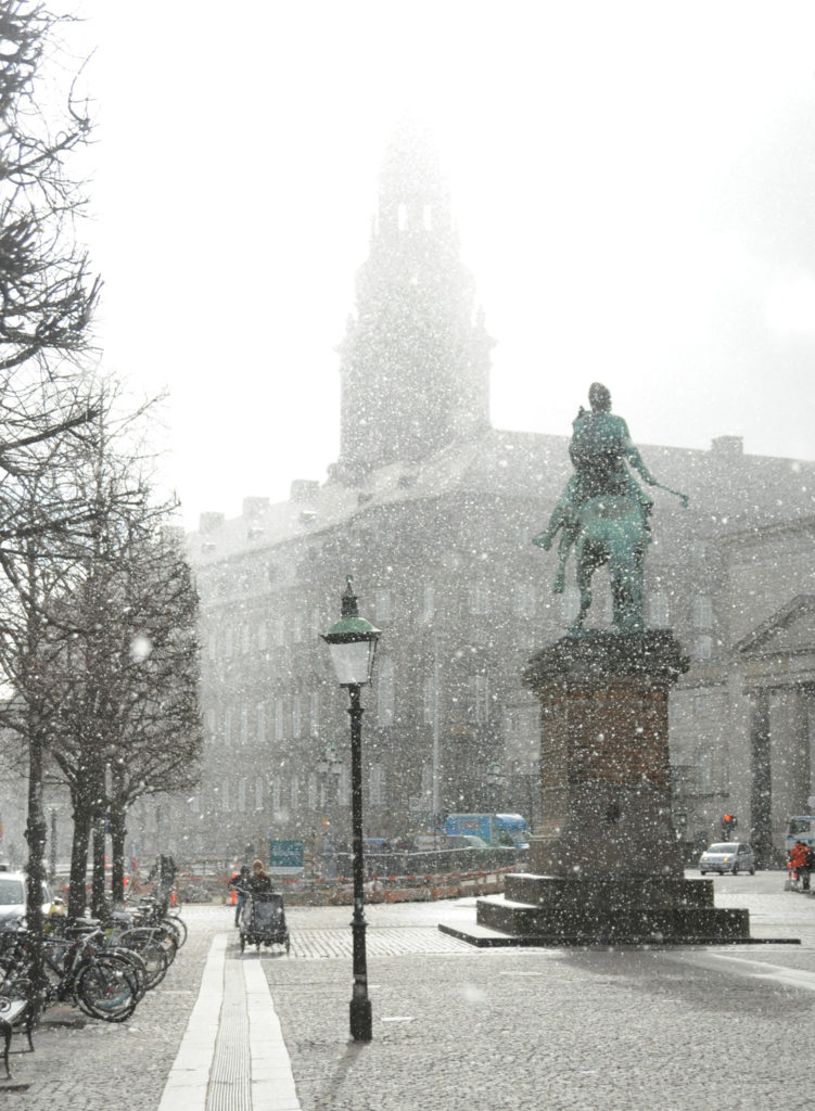 copenhagen snow on a statue