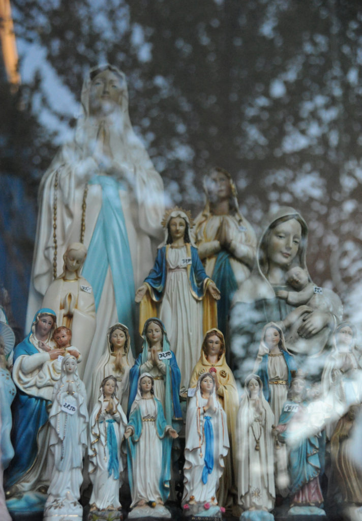 religious statuettes in a window